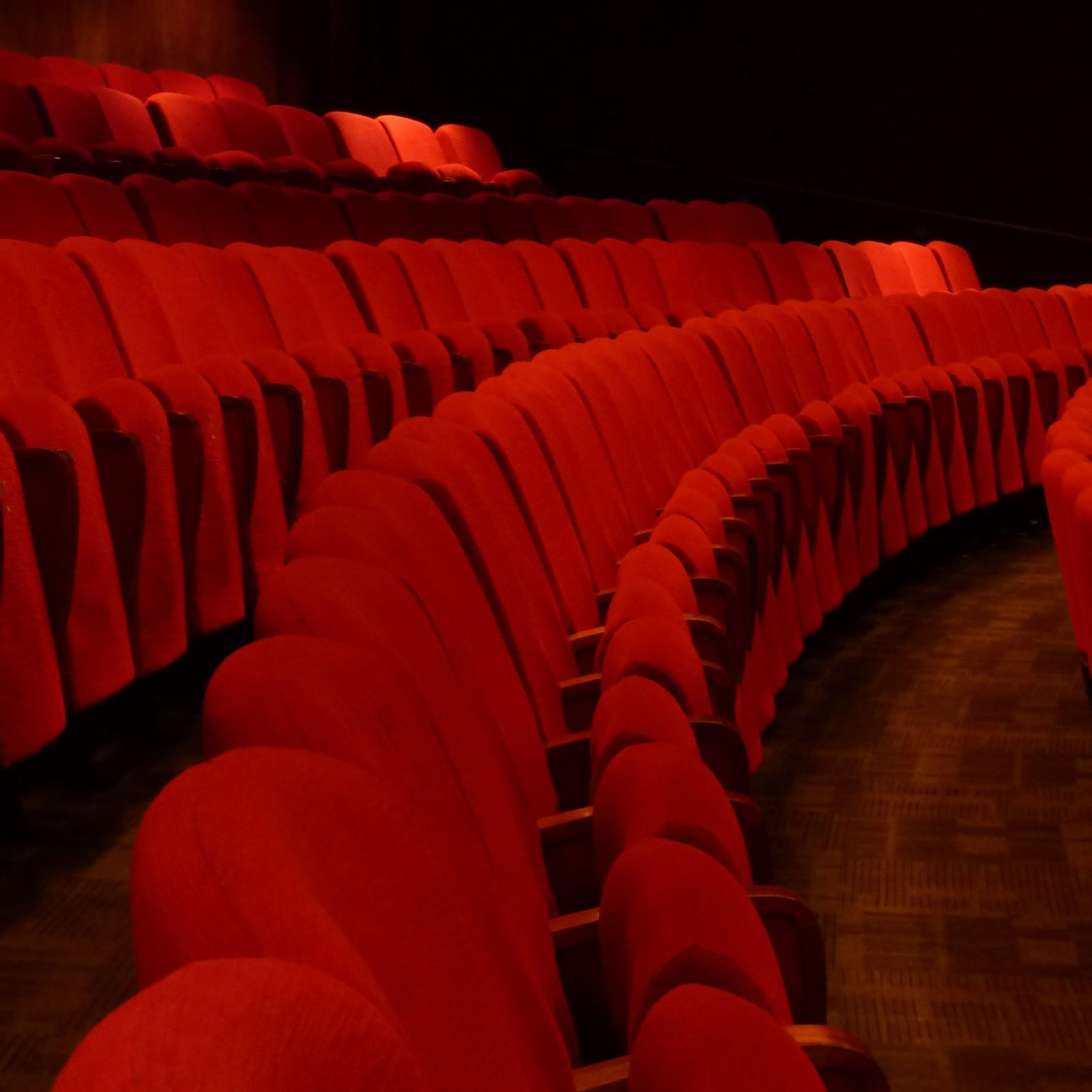 Rows of red seats inside the theater